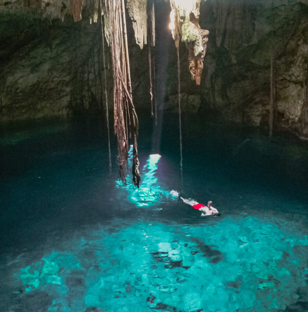non-touristy Cenote (Watercave) with turquoise water in Mexico