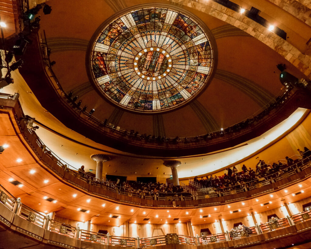 Join a cultural event in the Palace of Bellas Artes to see it in a unusual and unique way. Auditorium's ceiling of the Palace of Bellas Artes in Mexico City